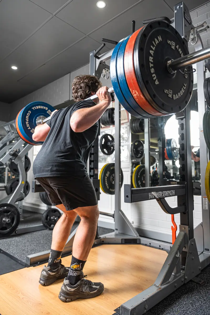 A member squatting in the rack